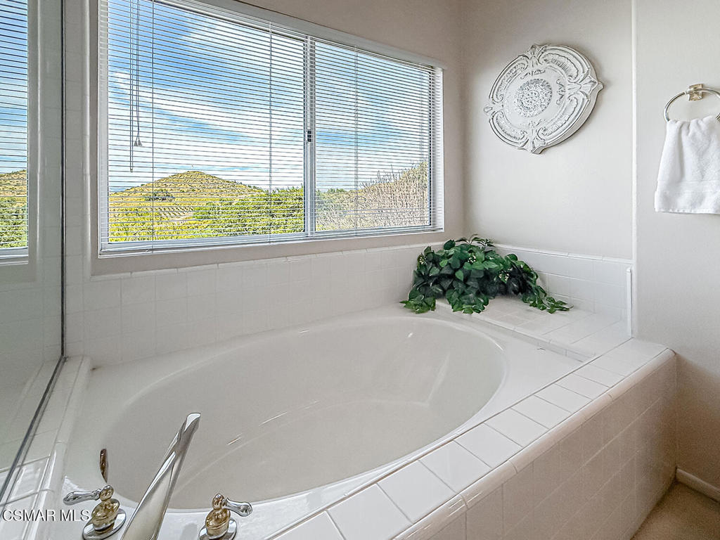 260 Sycamore Ridge Street Simi Valley, CA 93065 - Photo 38 of 58 a white bath tub sitting next to a window