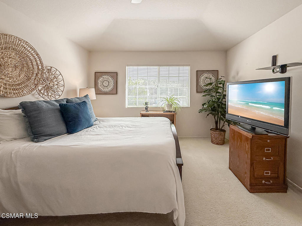 260 Sycamore Ridge Street Simi Valley, CA 93065 - Photo 43 of 58 a bedroom with a bed and a flat screen tv