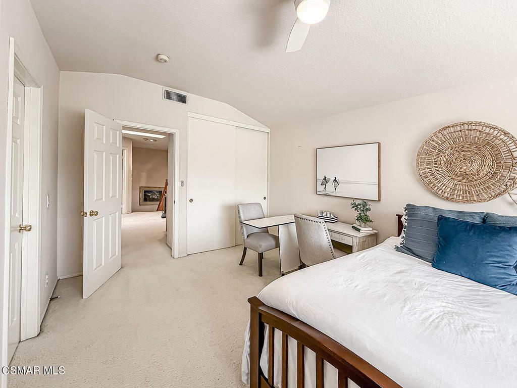 260 Sycamore Ridge Street Simi Valley, CA 93065 - Photo 44 of 58 a bedroom with two beds and a chandelier