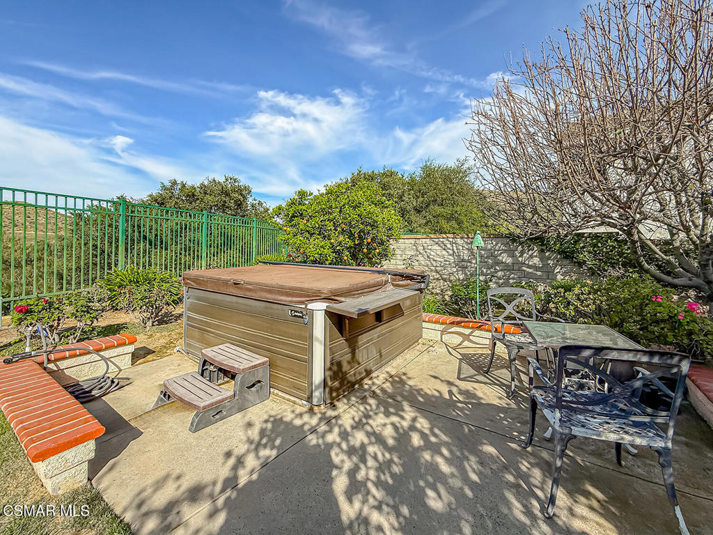 260 Sycamore Ridge Street Simi Valley, CA 93065 - Photo 56 of 58 a view of a patio with table and chairs with wooden floor and fence