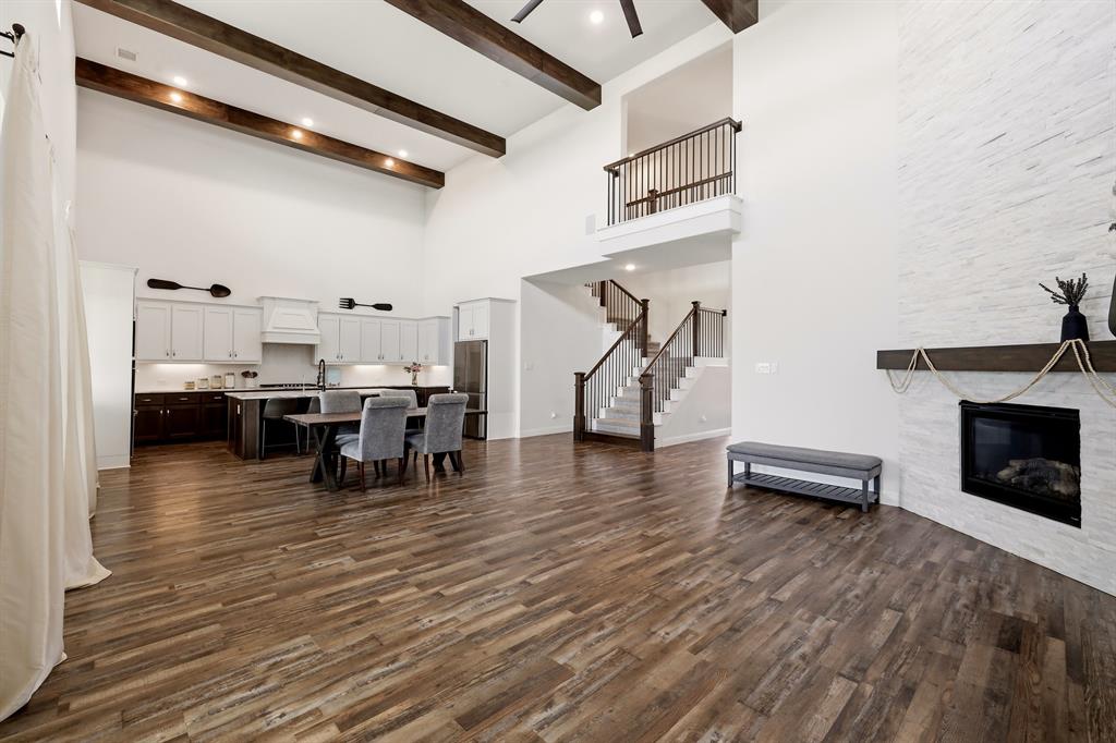 1313 Kirkwood Road Rockwall, TX 75087 - Photo 2 of 39 Gorgeous exposed wood beams in living room showing off the soaring 20 foot ceilings!