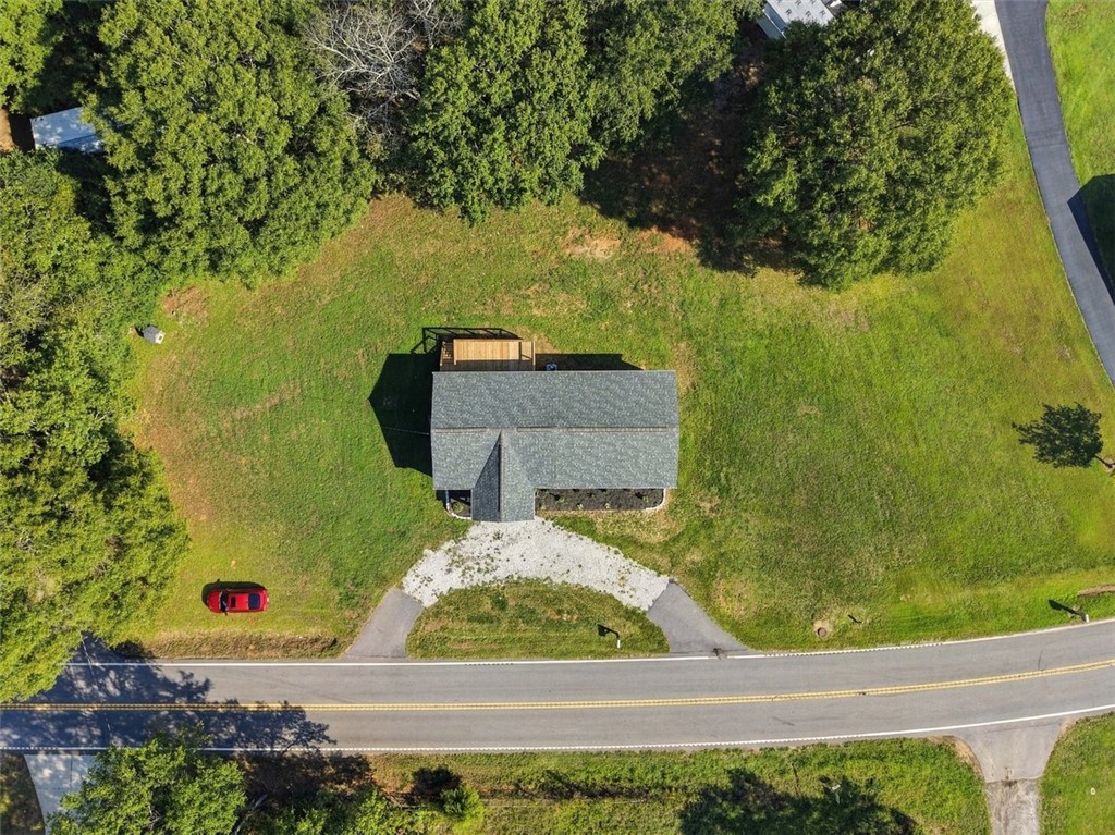 418 Old River Road Pelzer, SC 29669 - Photo 26 of 32 A spacious green lot surrounds the home in this bird's-eye aerial view.