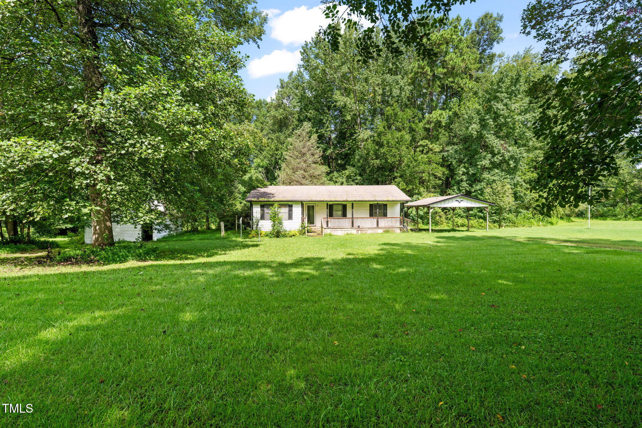 720 Division Street Norlina, NC 27563 - Photo 1 of 38 a front view of a house with a garden