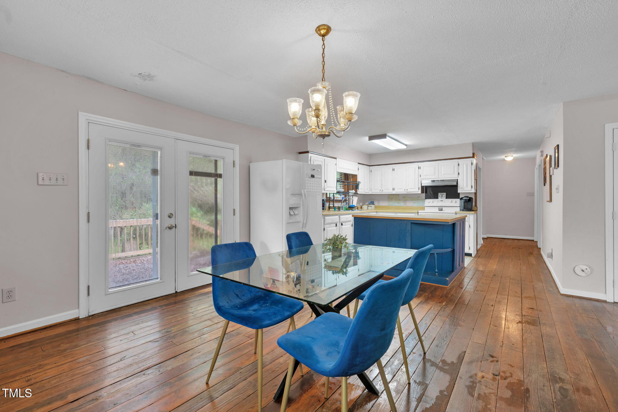 720 Division Street Norlina, NC 27563 - Photo 11 of 38 a view of a dining room with furniture wooden floor and chandelier
