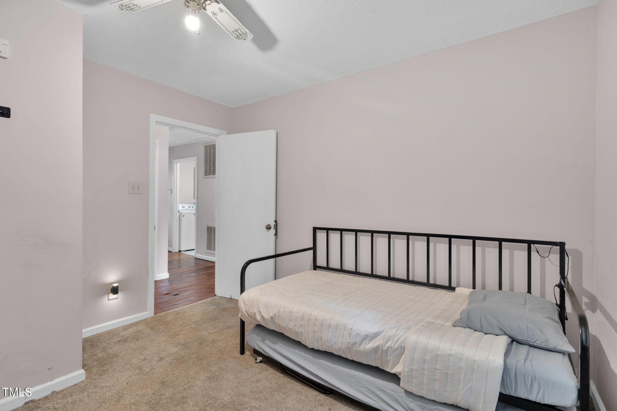 720 Division Street Norlina, NC 27563 - Photo 21 of 38 a bed room with a bed and a chair