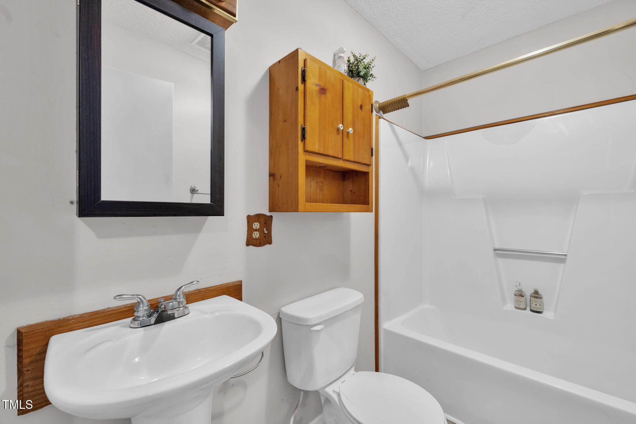 720 Division Street Norlina, NC 27563 - Photo 22 of 38 a bathroom with a sink toilet and shower