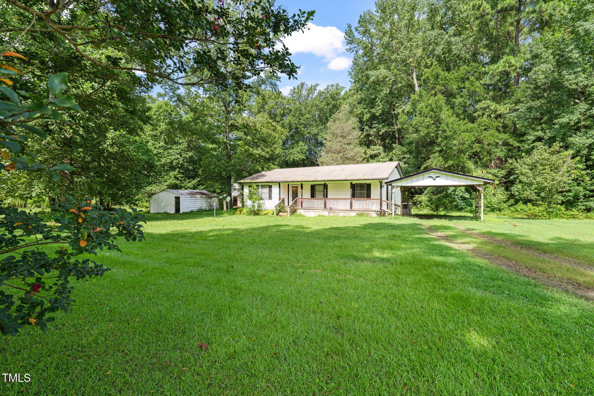 720 Division Street Norlina, NC 27563 - Photo 33 of 38 a front view of a house with a garden