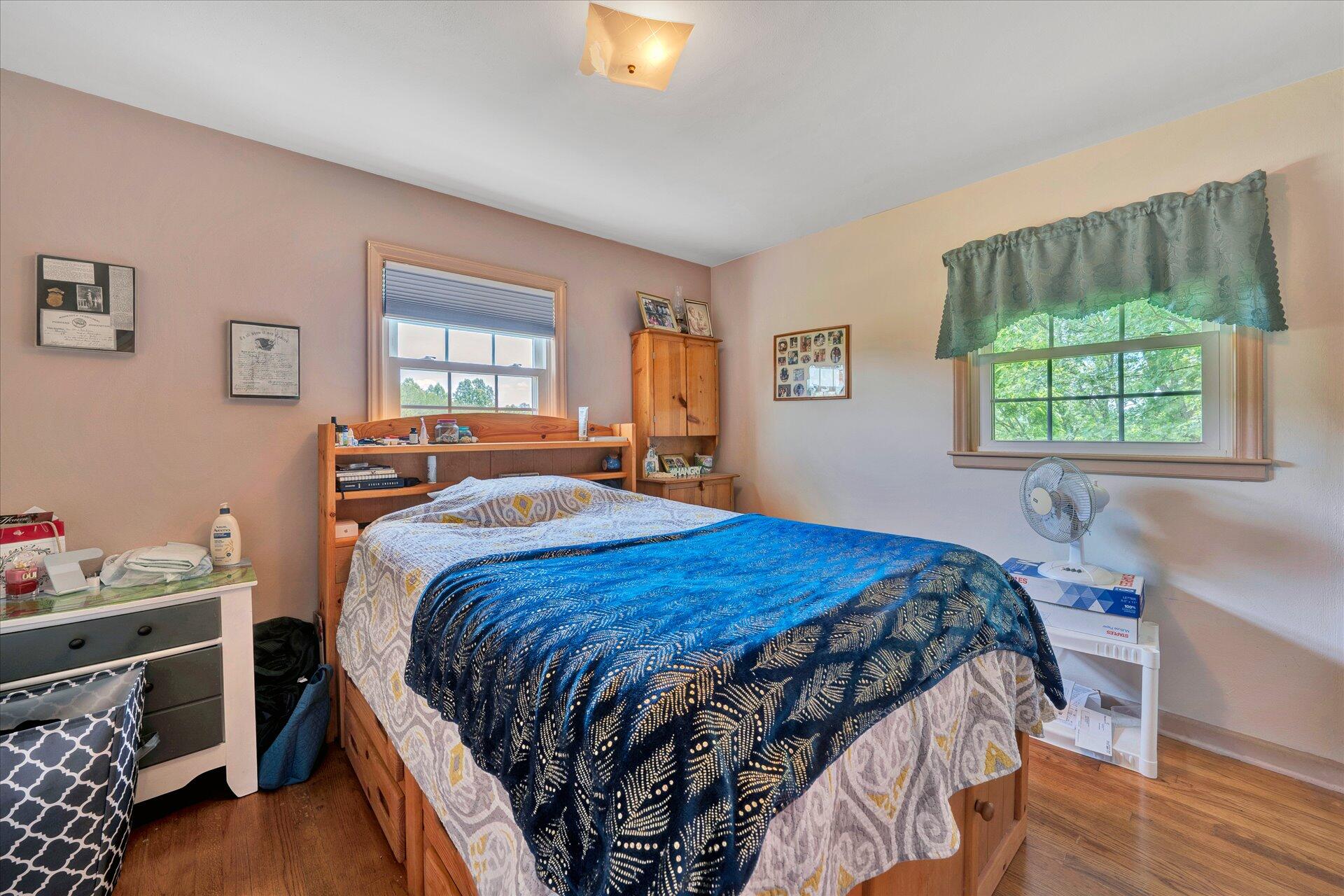 2407 White House Road Moneta, VA 24121 - Photo 17 of 52 a bedroom with a bed and a window