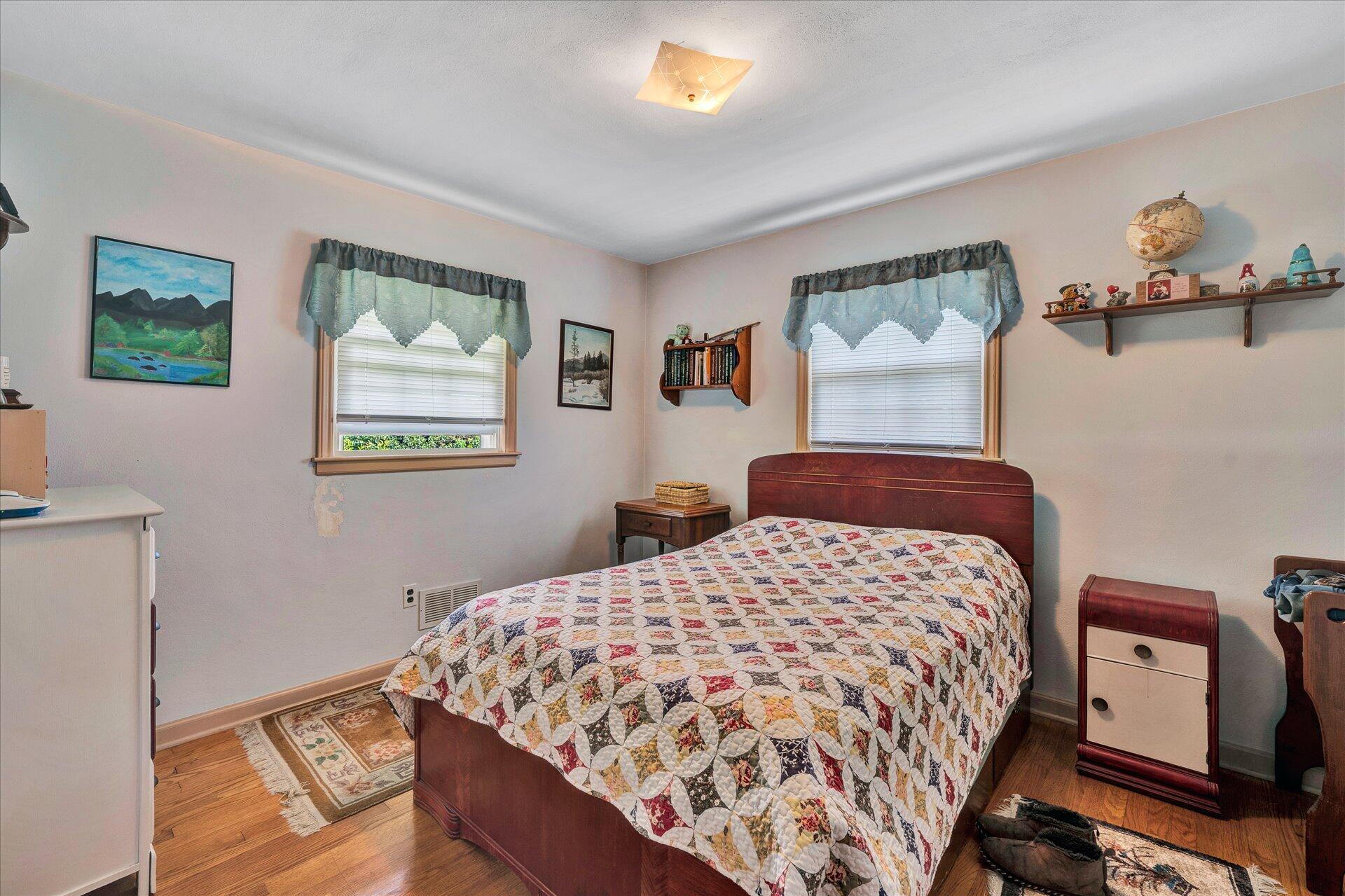 2407 White House Road Moneta, VA 24121 - Photo 18 of 52 a bedroom with a bed and a window