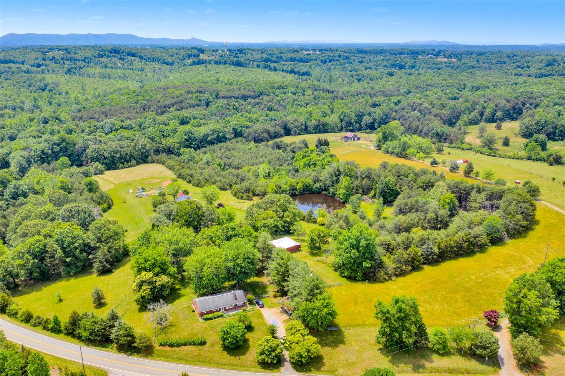 2407 White House Road Moneta, VA 24121 - Photo 3 of 52 a view of a garden with a lake