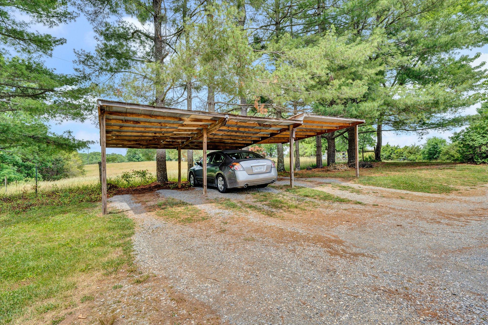 2407 White House Road Moneta, VA 24121 - Photo 27 of 52 a front view of a house with garden