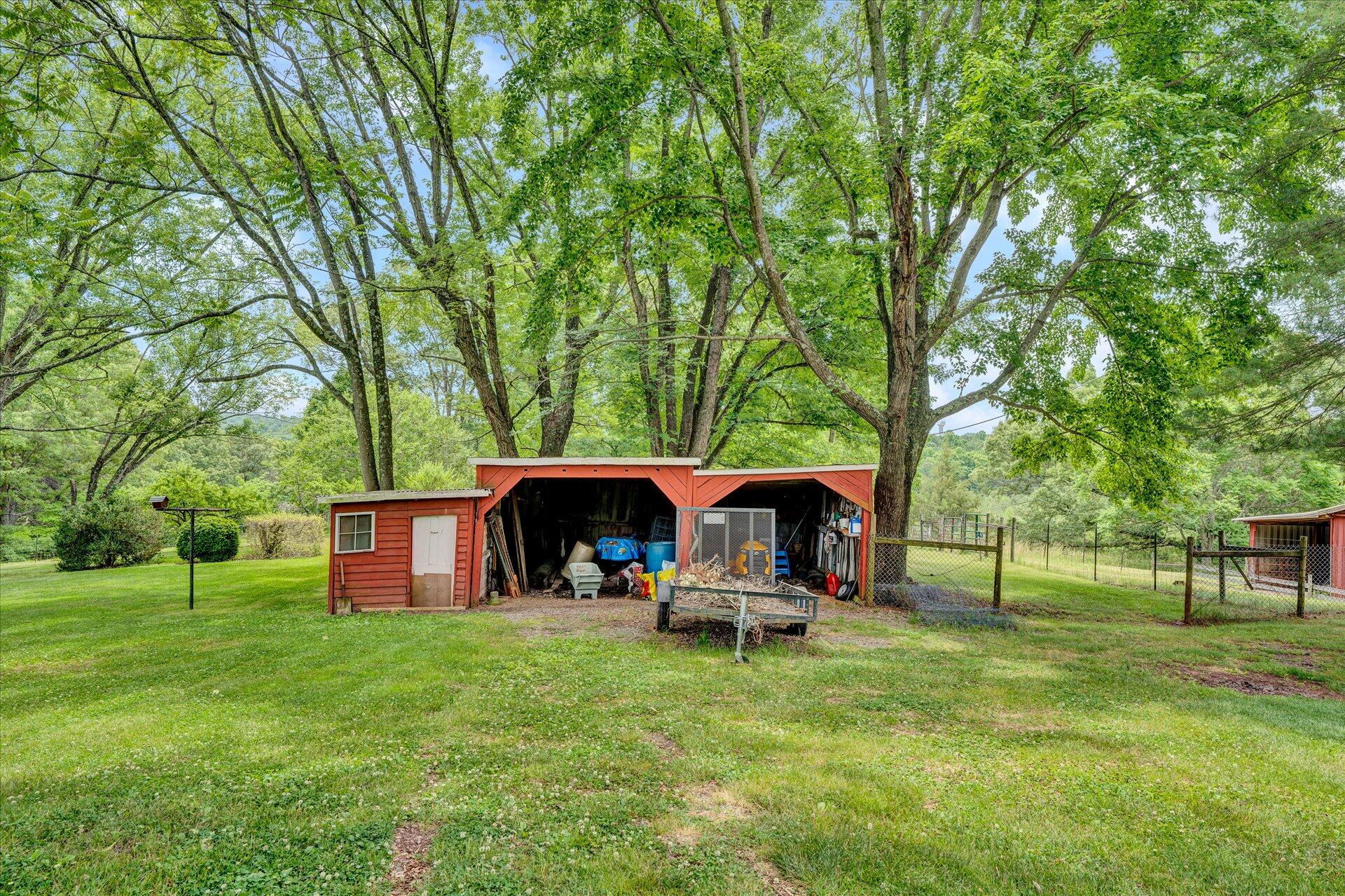 2407 White House Road Moneta, VA 24121 - Photo 28 of 52 a view of a house with backyard and sitting area