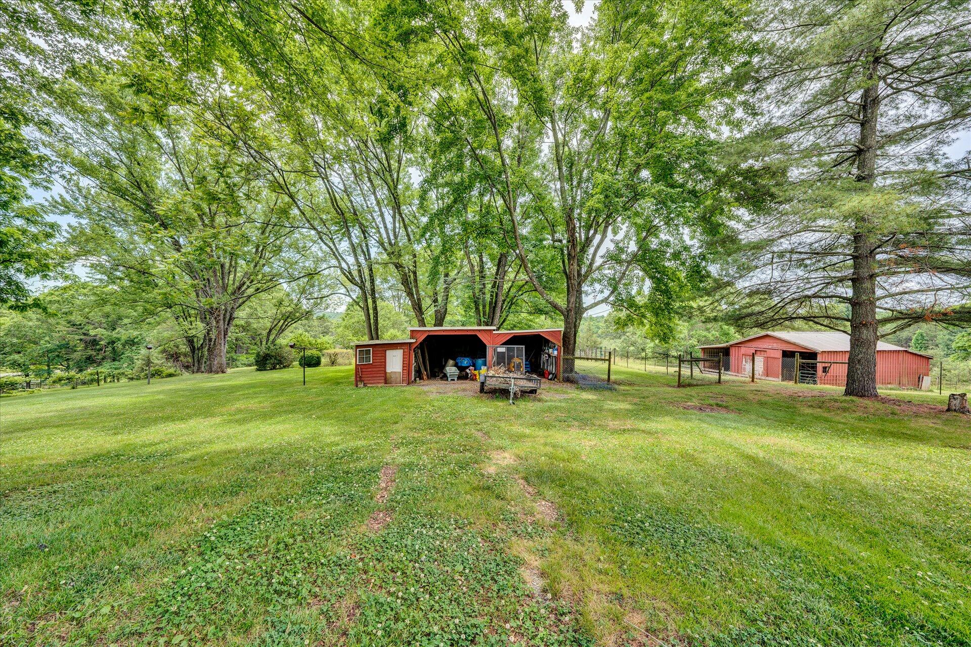 2407 White House Road Moneta, VA 24121 - Photo 29 of 52 a front view of a house with a yard
