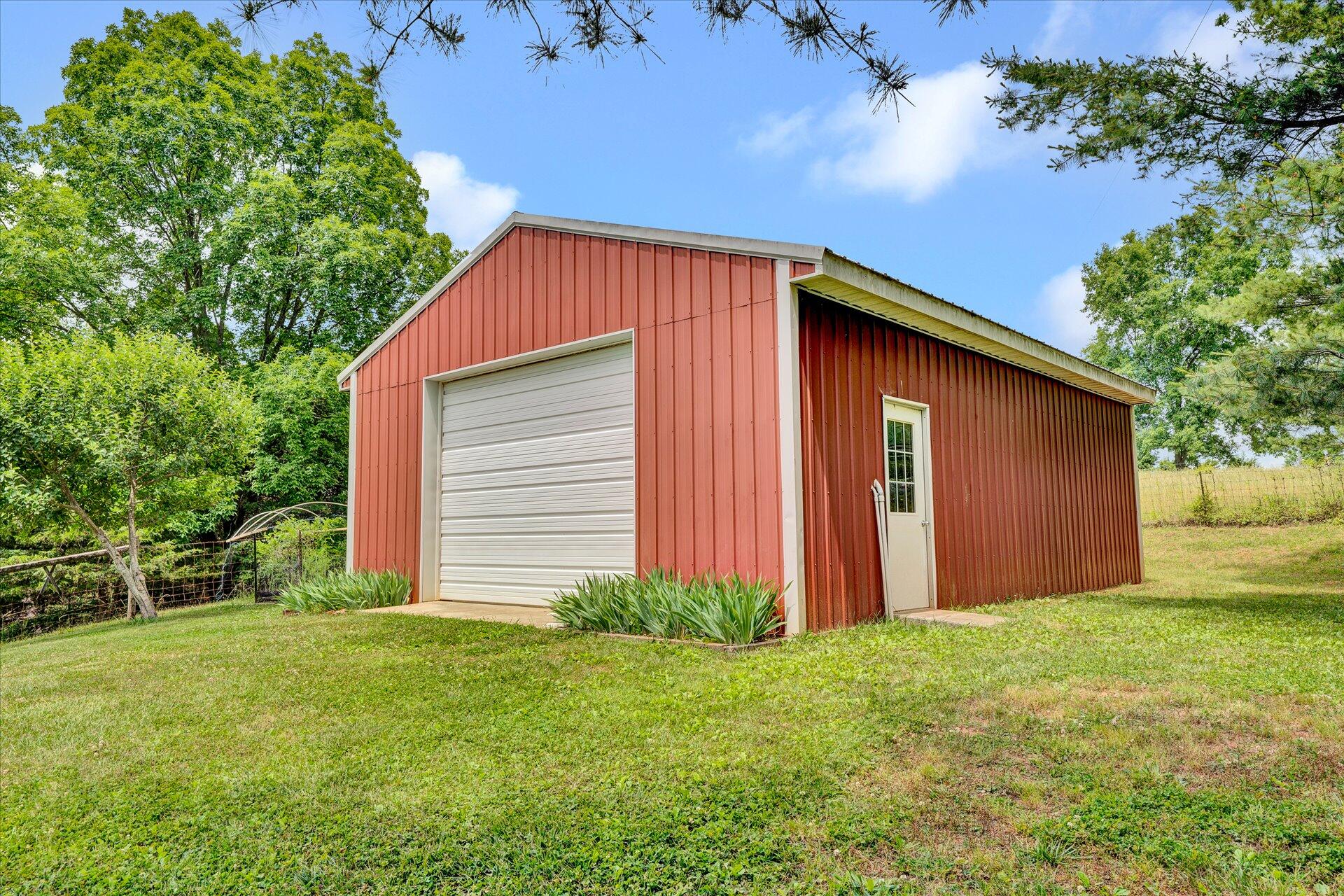 2407 White House Road Moneta, VA 24121 - Photo 32 of 52 a front view of house with backyard and green space