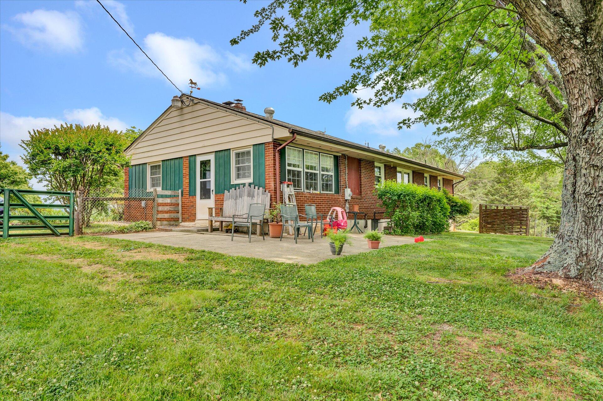 2407 White House Road Moneta, VA 24121 - Photo 33 of 52 a front view of house with yard and outdoor seating