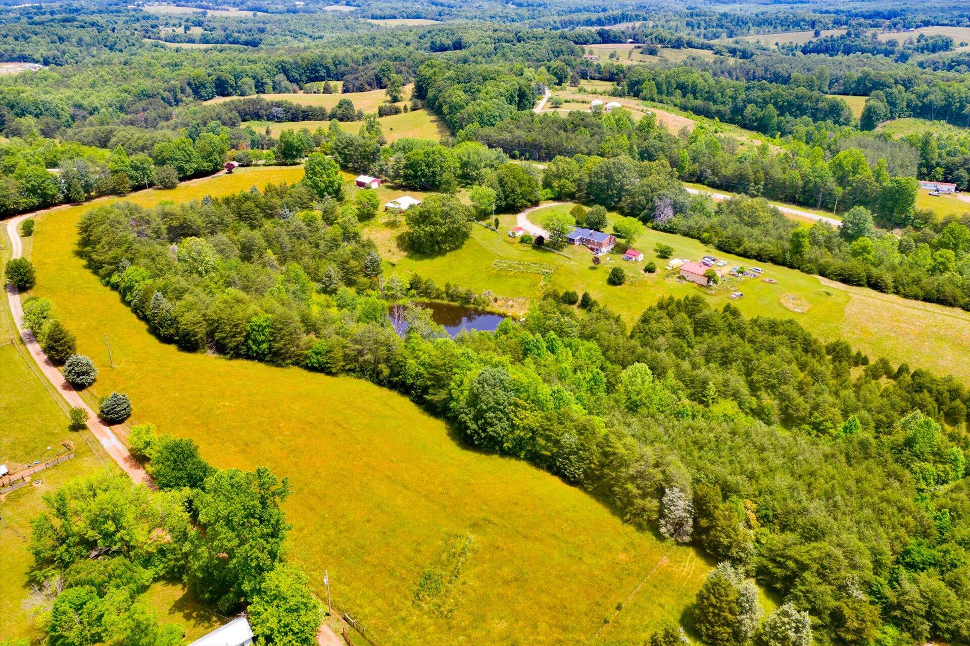 2407 White House Road Moneta, VA 24121 - Photo 36 of 52 a view of a swimming pool with a garden