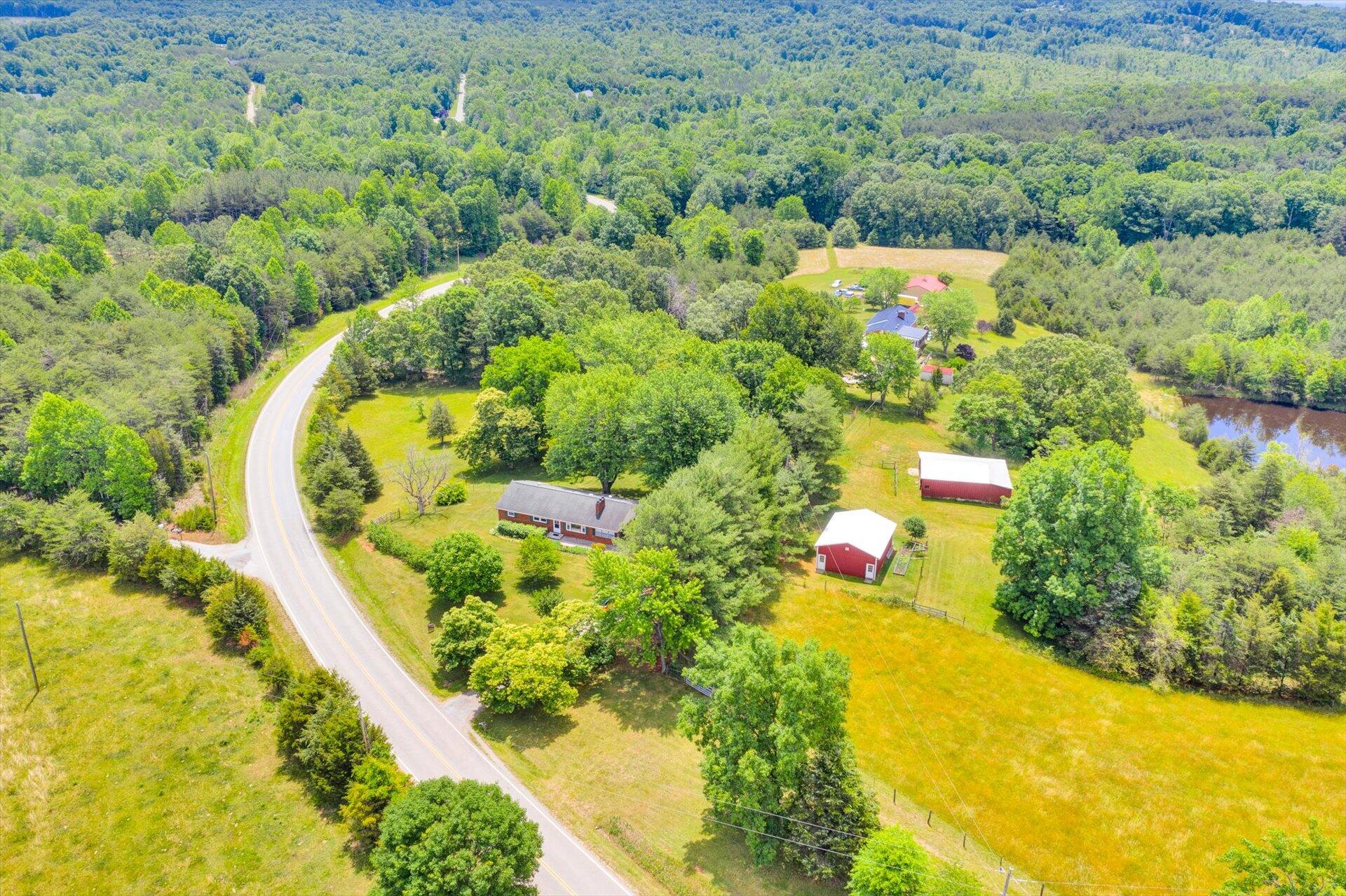 2407 White House Road Moneta, VA 24121 - Photo 40 of 52 an aerial view of residential house with swimming pool and lawn chairs