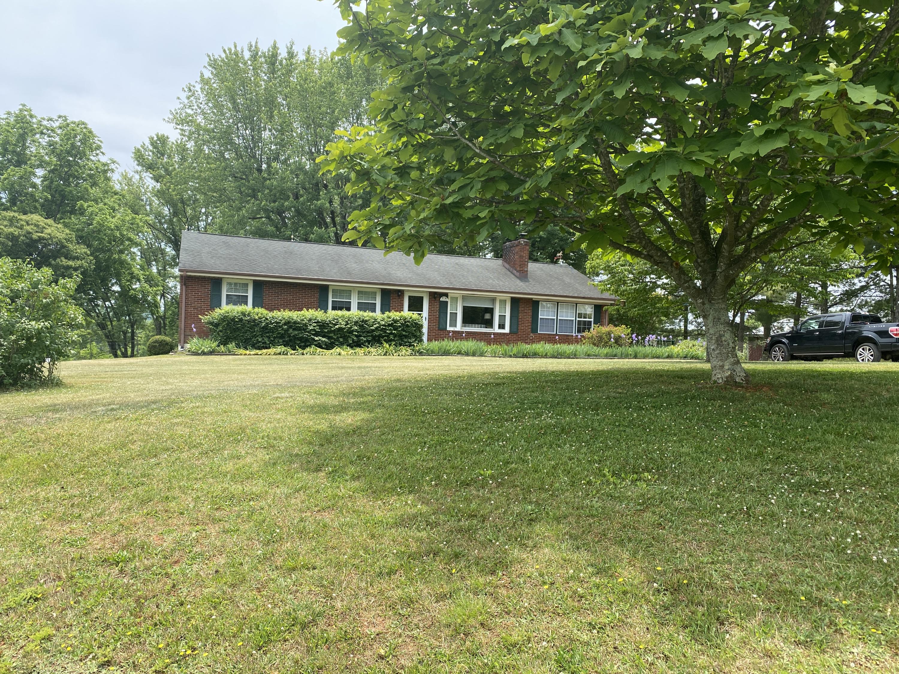 2407 White House Road Moneta, VA 24121 - Photo 42 of 52 a house view with swimming pool and green space