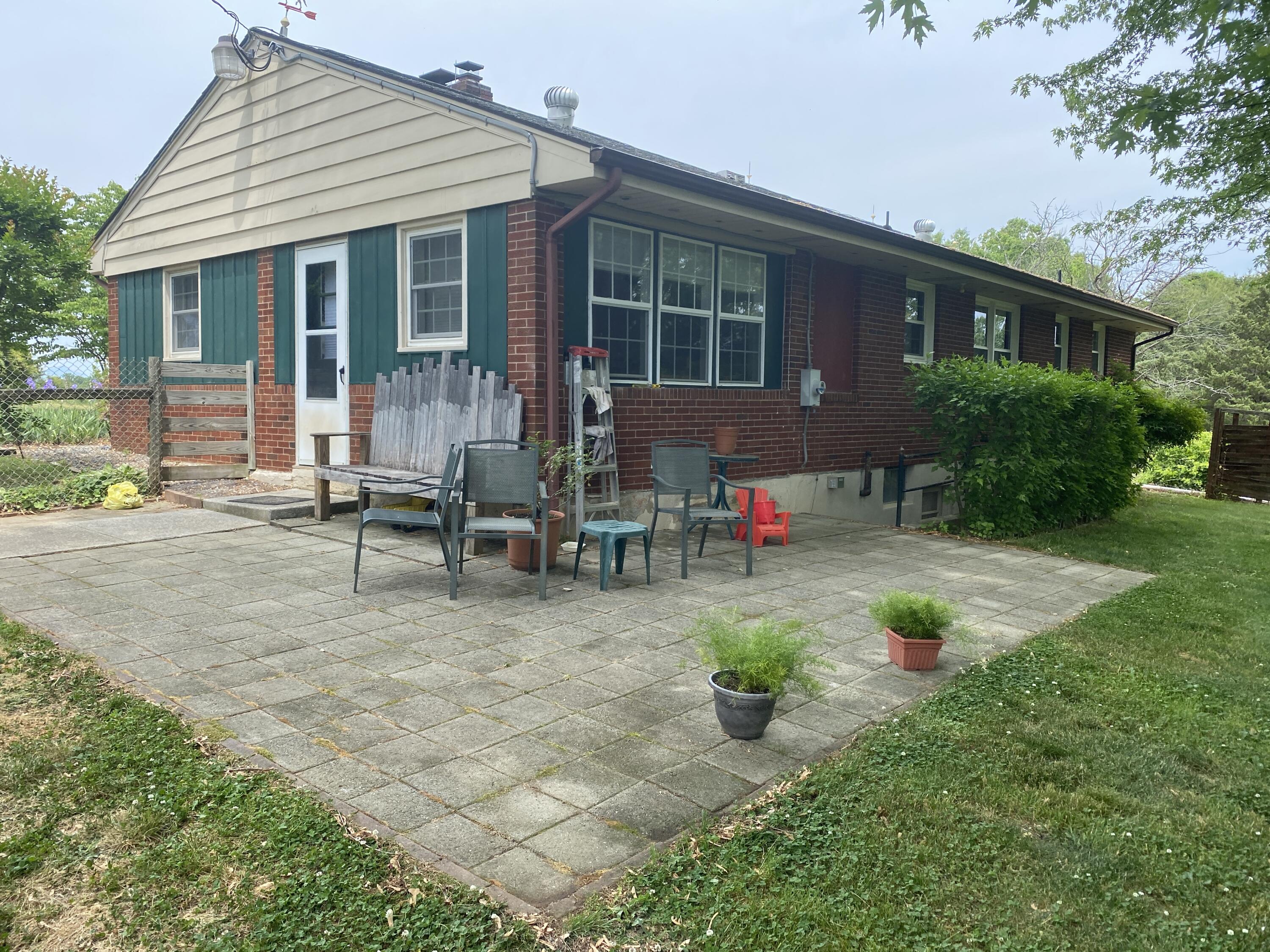 2407 White House Road Moneta, VA 24121 - Photo 49 of 52 a view of backyard with table and chairs and potted plants