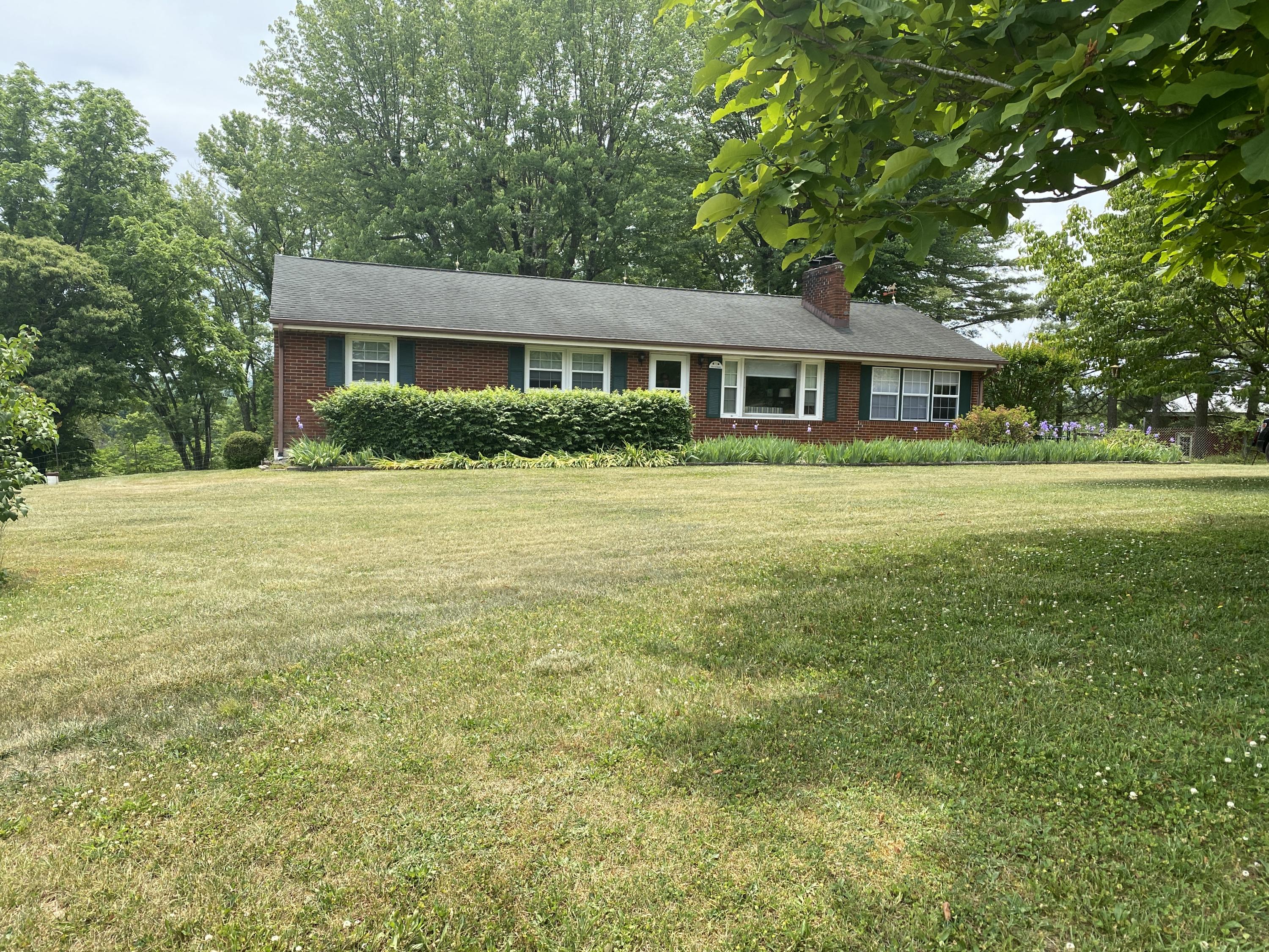 2407 White House Road Moneta, VA 24121 - Photo 50 of 52 a front view of a house with a yard