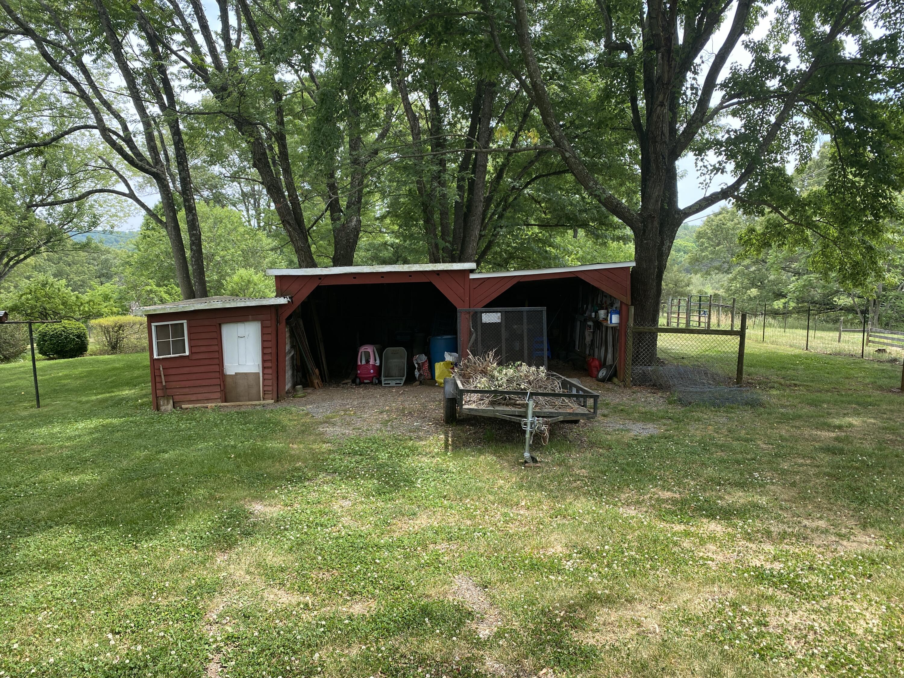 2407 White House Road Moneta, VA 24121 - Photo 51 of 52 a view of a house with a yard porch and sitting area