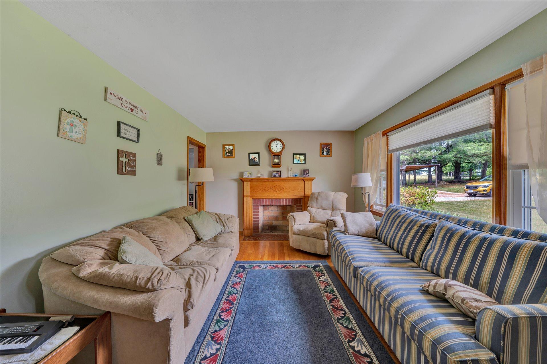 2407 White House Road Moneta, VA 24121 - Photo 9 of 52 a living room with furniture and a large window