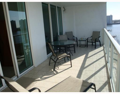 18100 North Bay Road, Unit 1006 Sunny Isles Beach, FL 33160 - Photo 5 of 8 a view of a room with furniture and wooden floor