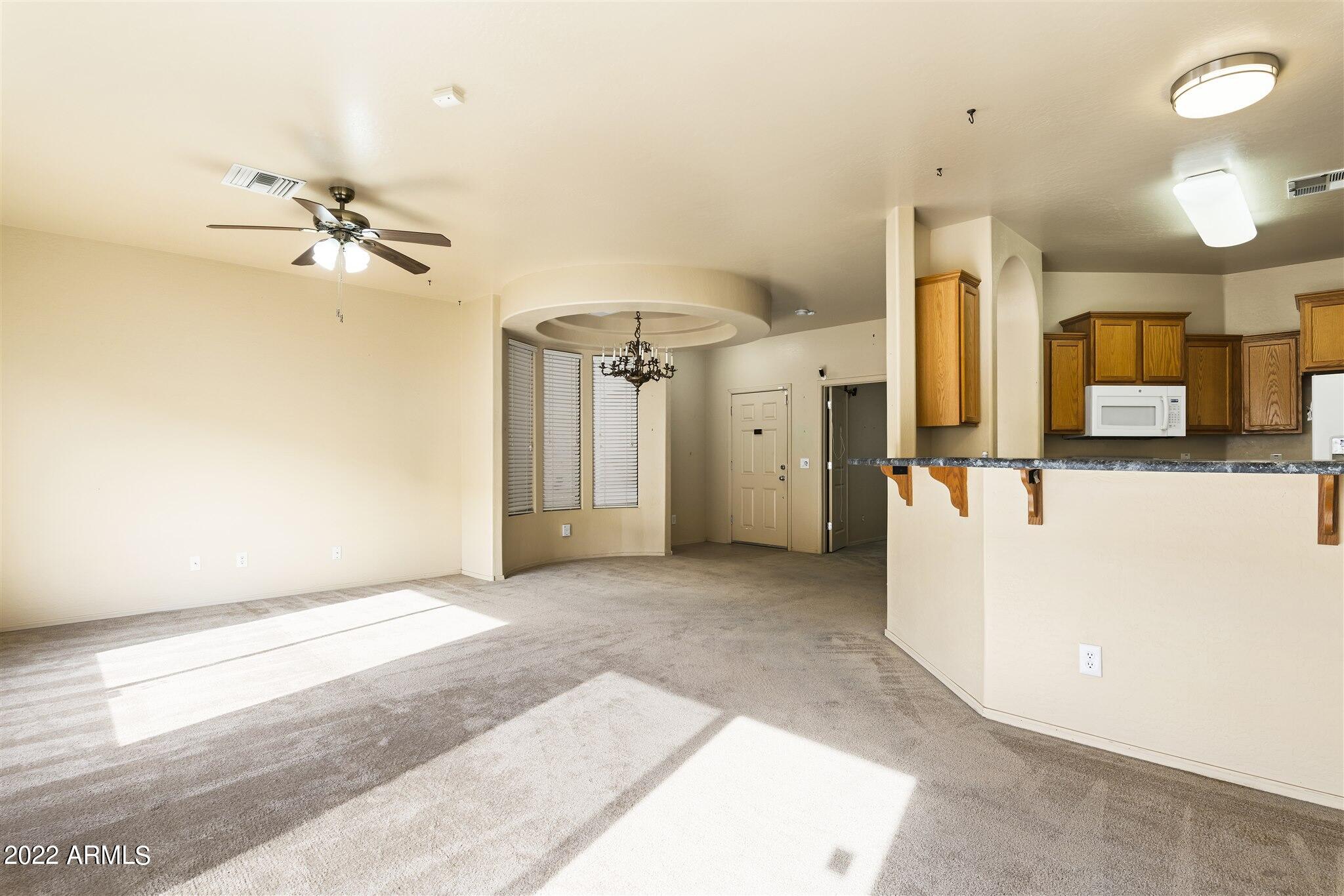 2565 South Signal Butte Road, Unit 31 Mesa, AZ 85209 - Photo 8 of 33 View to Office/Bedroom 3 & Kitchen