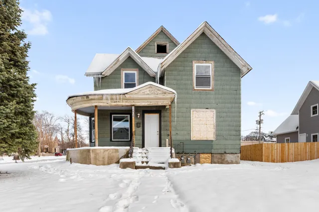 a view of a house with outdoor space and porch