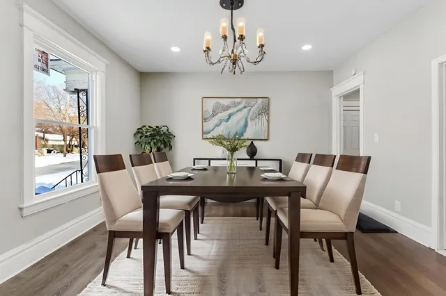 a view of a dining room with furniture window and wooden floor