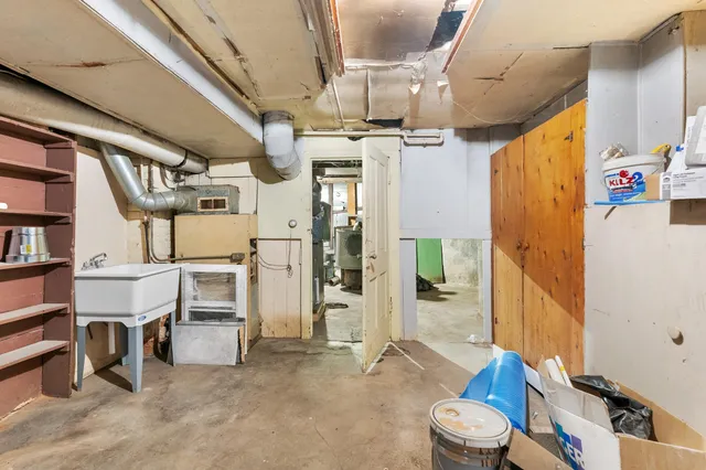 a garage with white cabinets