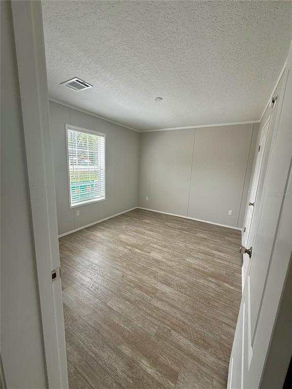 37743 Geiger Road Zephyrhills, FL 33542 - Photo 12 of 21 an empty room with windows