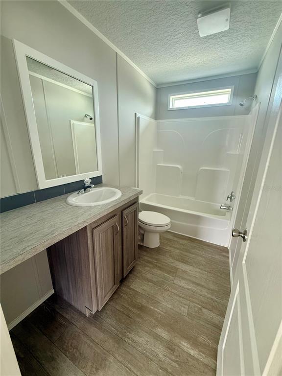 37743 Geiger Road Zephyrhills, FL 33542 - Photo 15 of 21 a bathroom with a sink a toilet and shower