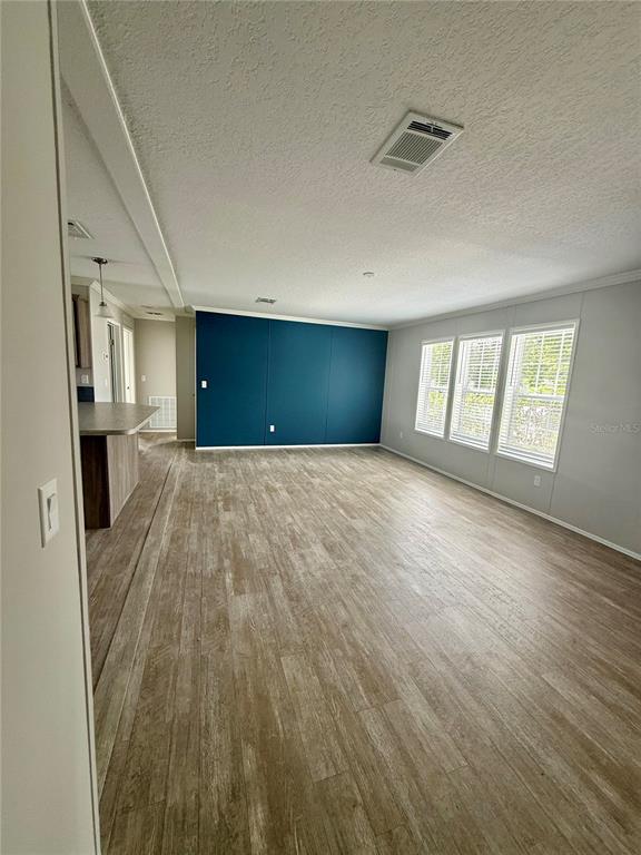 37743 Geiger Road Zephyrhills, FL 33542 - Photo 17 of 21 a view of wooden floor and windows in a room