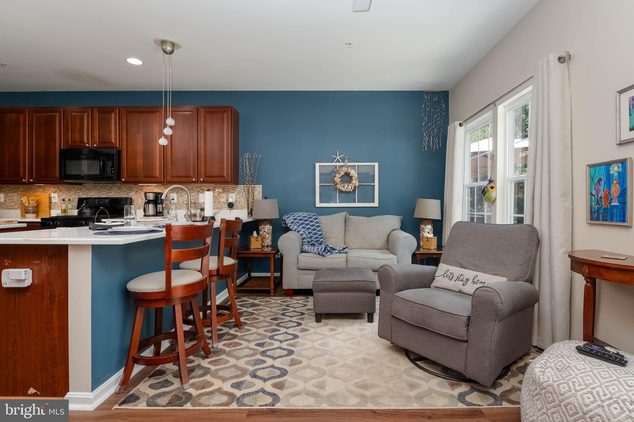 3107 Raking Leaf Drive Abingdon, MD 21009 - Photo 12 of 39 a living room with furniture a wooden floor and a window