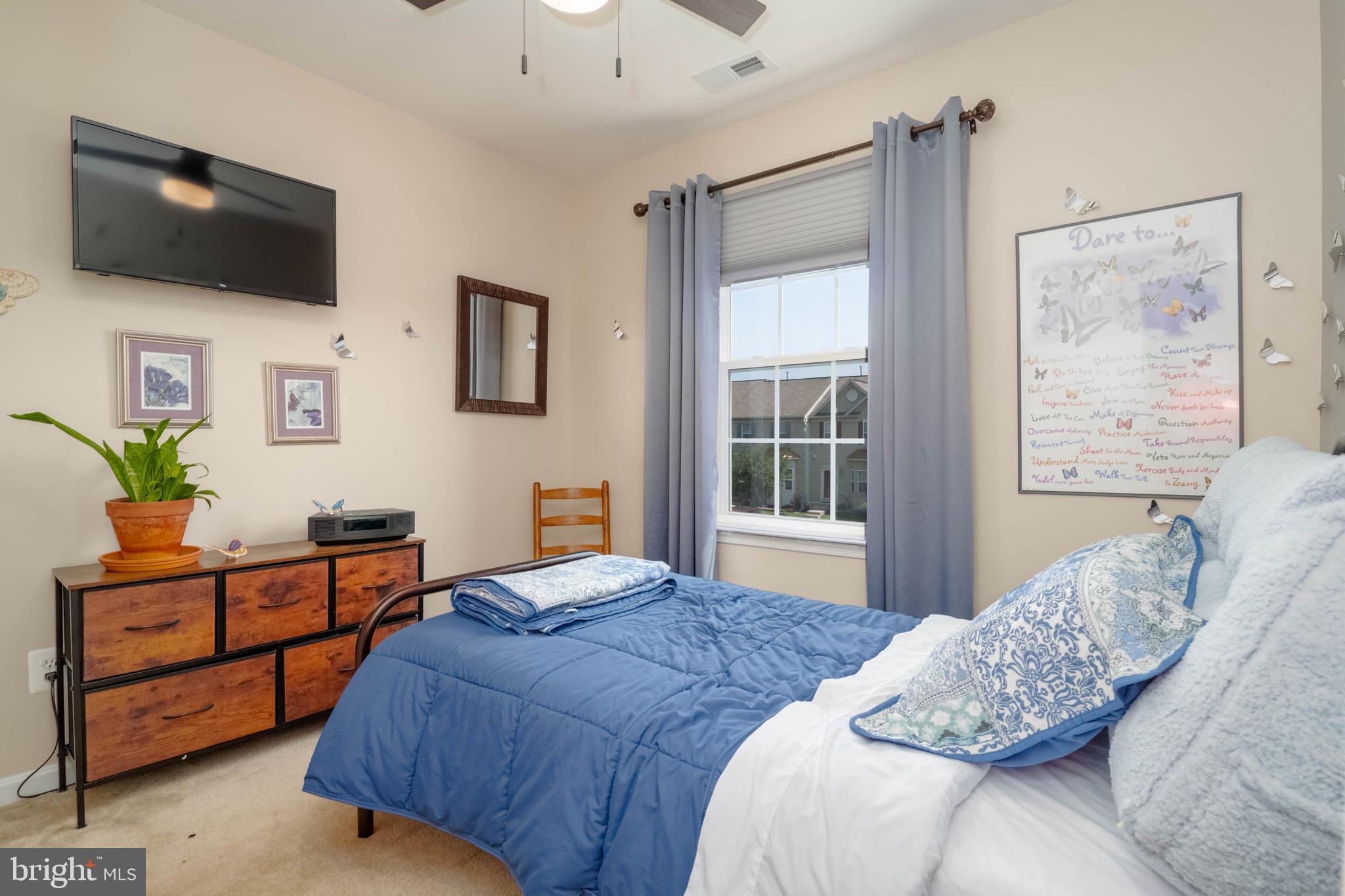 3107 Raking Leaf Drive Abingdon, MD 21009 - Photo 13 of 39 a bedroom with a bed a flat screen tv and a window