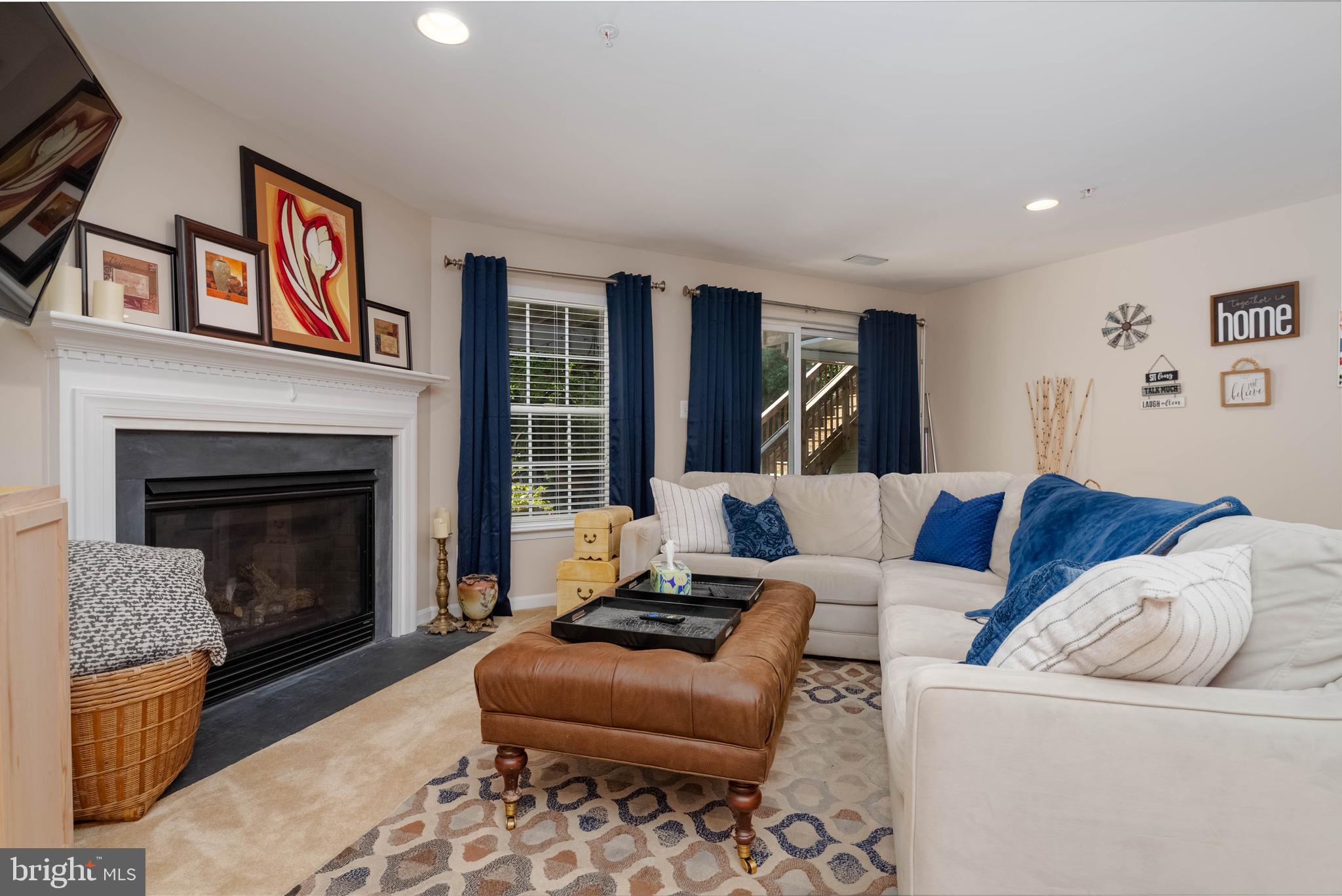 3107 Raking Leaf Drive Abingdon, MD 21009 - Photo 24 of 39 a living room with furniture and a fireplace