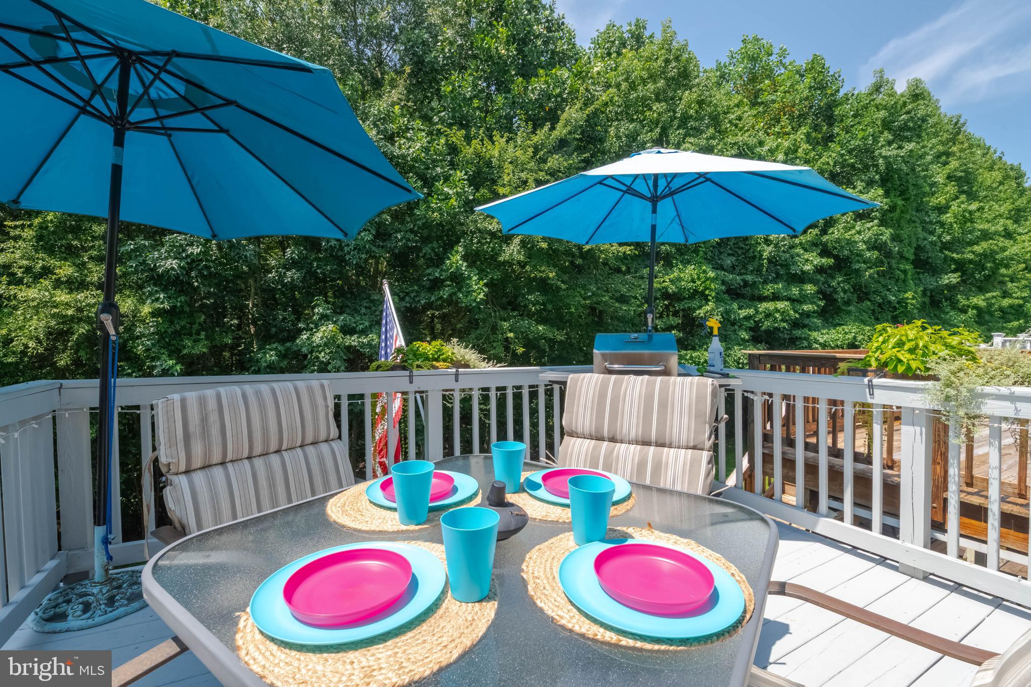 3107 Raking Leaf Drive Abingdon, MD 21009 - Photo 35 of 39 a view of a table and chairs under an umbrella