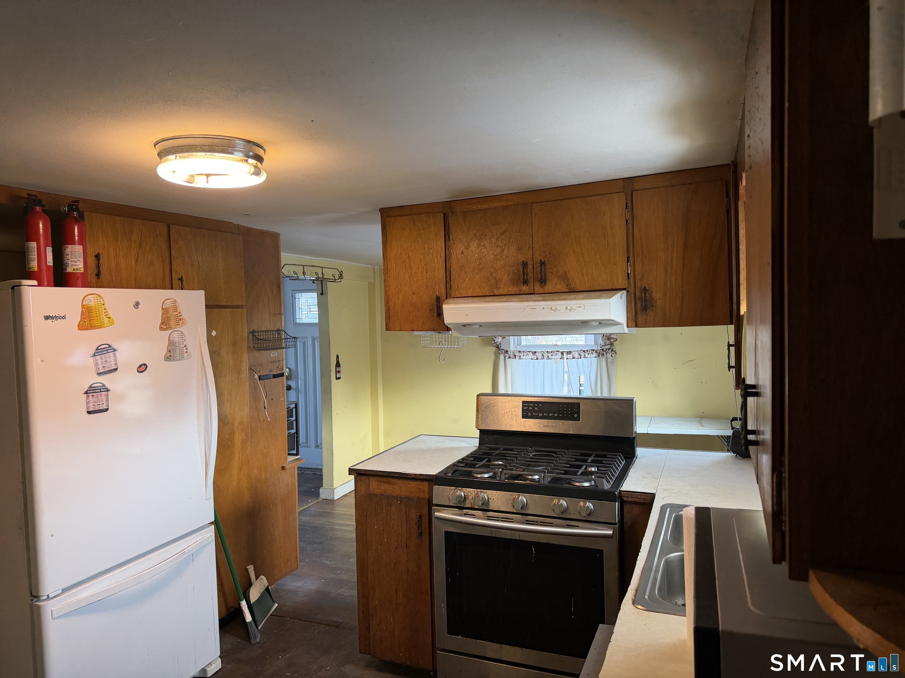 292 Old Colchester Road Montville, CT 06382 - Photo 14 of 18 a kitchen with a stove and a refrigerator