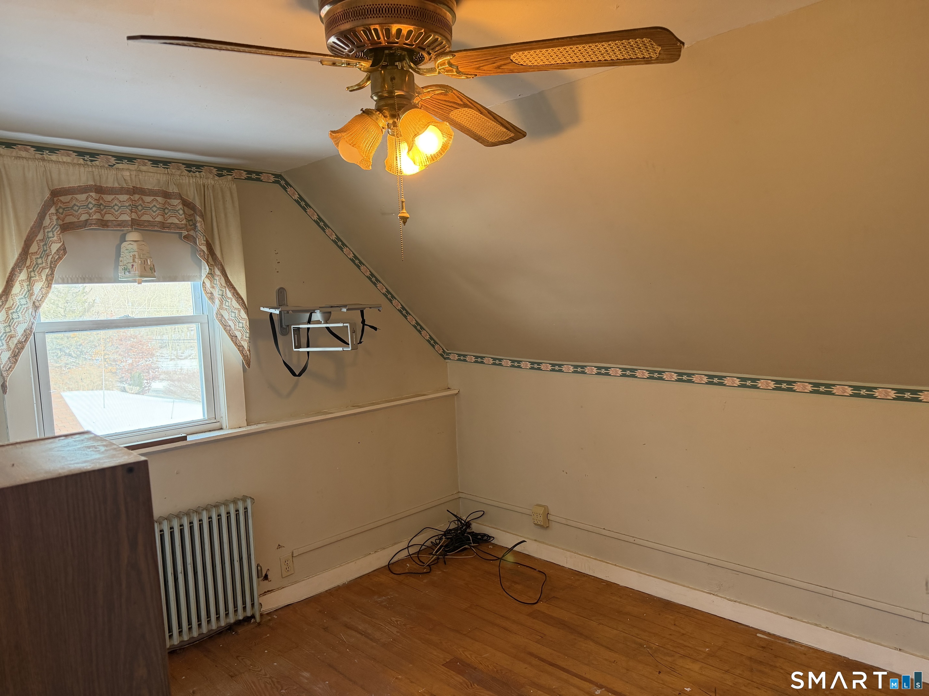 292 Old Colchester Road Montville, CT 06382 - Photo 17 of 18 a view of a ceiling fan and a window
