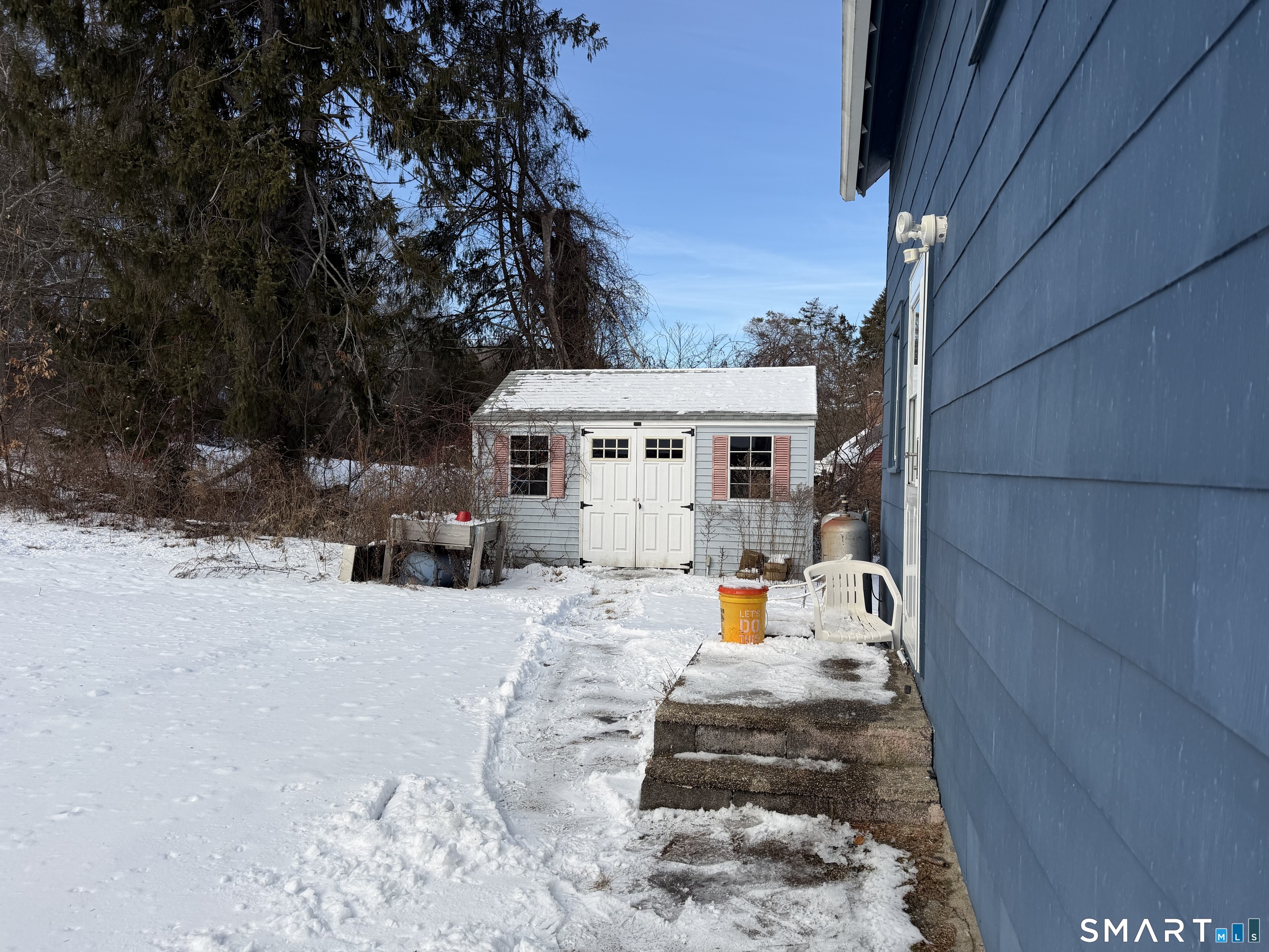 292 Old Colchester Road Montville, CT 06382 - Photo 6 of 18 a view of a house with a yard covered in snow