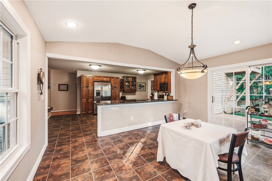 2001 Ridgeview Lane Seneca, SC 29678 - Photo 9 of 27 A well-appointed kitchen and dining area feature rich cabinetry and convenient outdoor access.