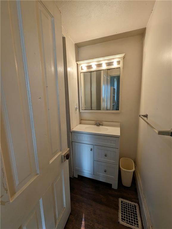 300 Jackson Street Rochester, PA 15074 - Photo 5 of 10 a bathroom with a mirror and a sink