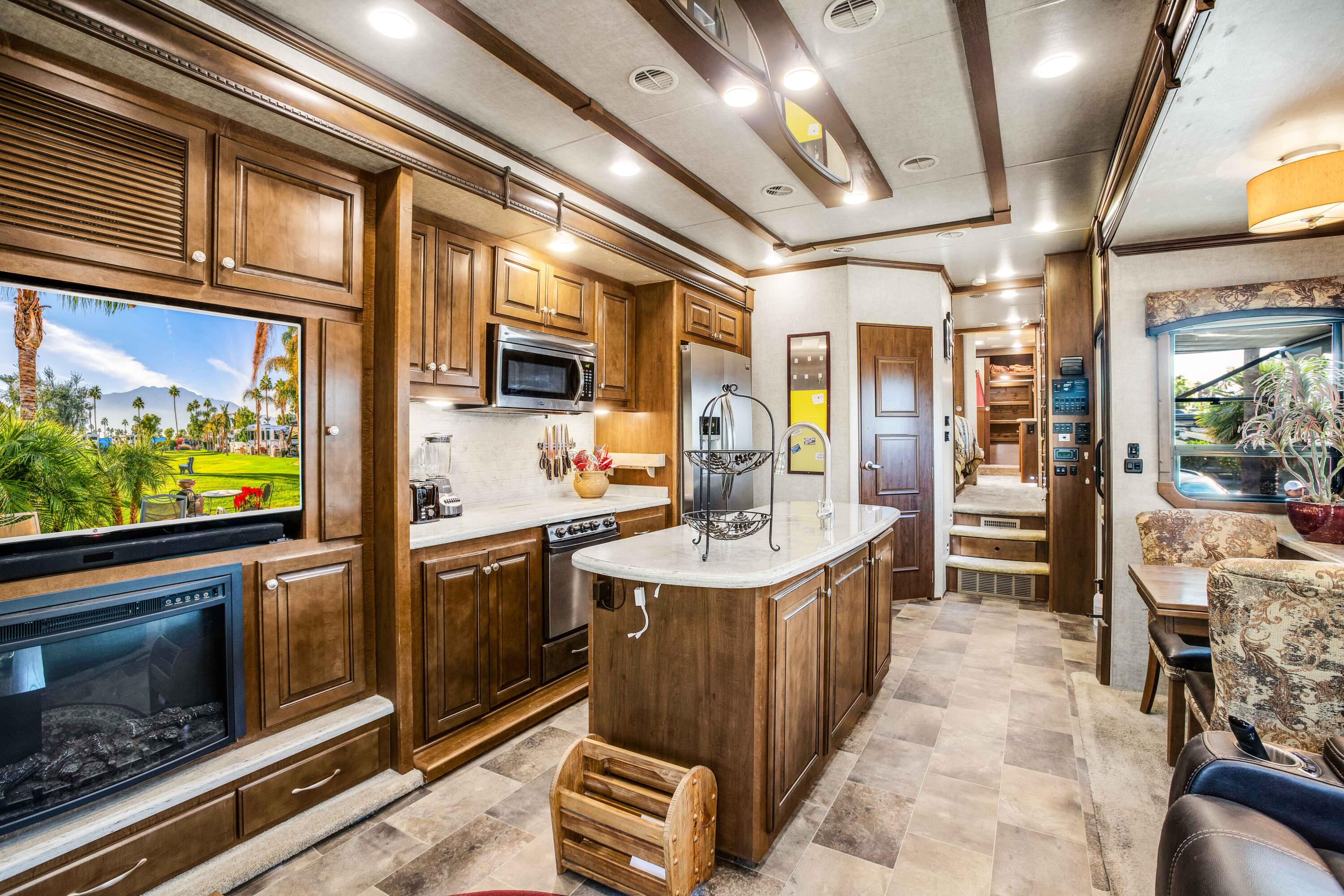 69411 Ramon Road, Unit 131 Cathedral City, CA 92234 - Photo 13 of 65 a kitchen with stainless steel appliances granite countertop a sink and cabinets