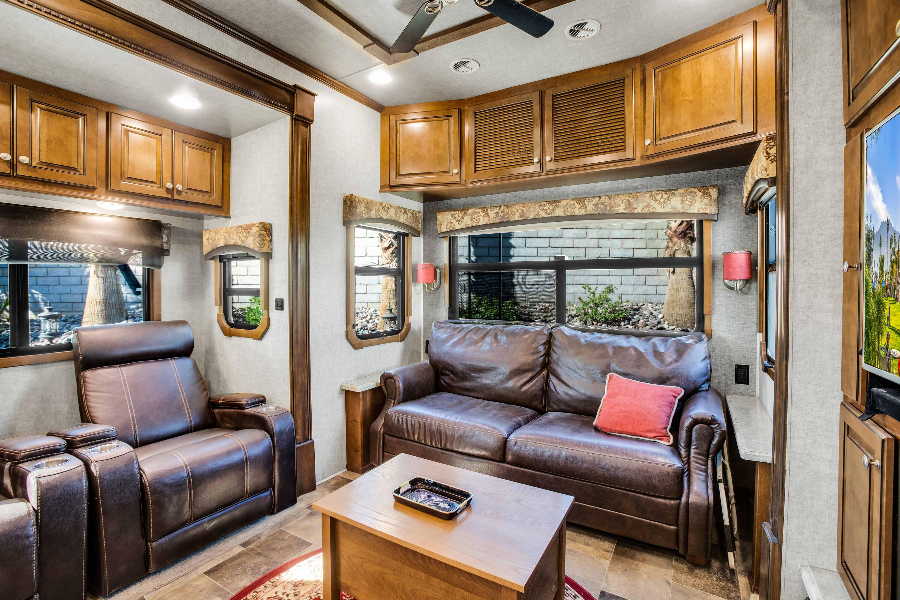 69411 Ramon Road, Unit 131 Cathedral City, CA 92234 - Photo 4 of 65 a living room with furniture a fireplace and a chandelier
