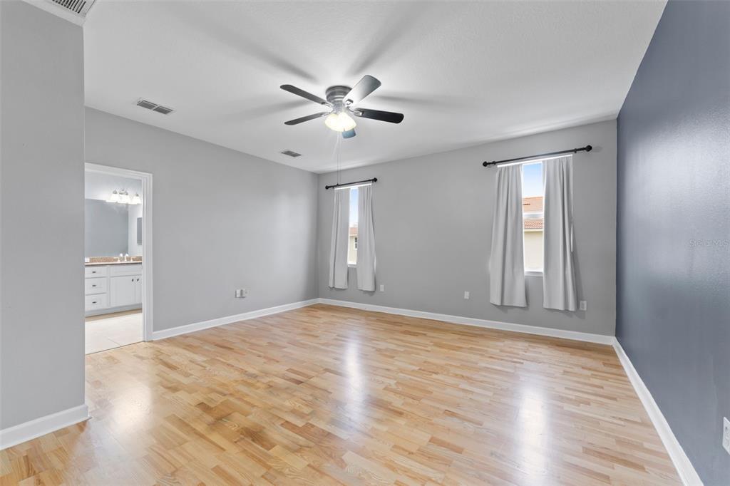 1264 Riserva Lane Palm Harbor, FL 34683 - Photo 11 of 28 a view of an empty room with window and wooden floor