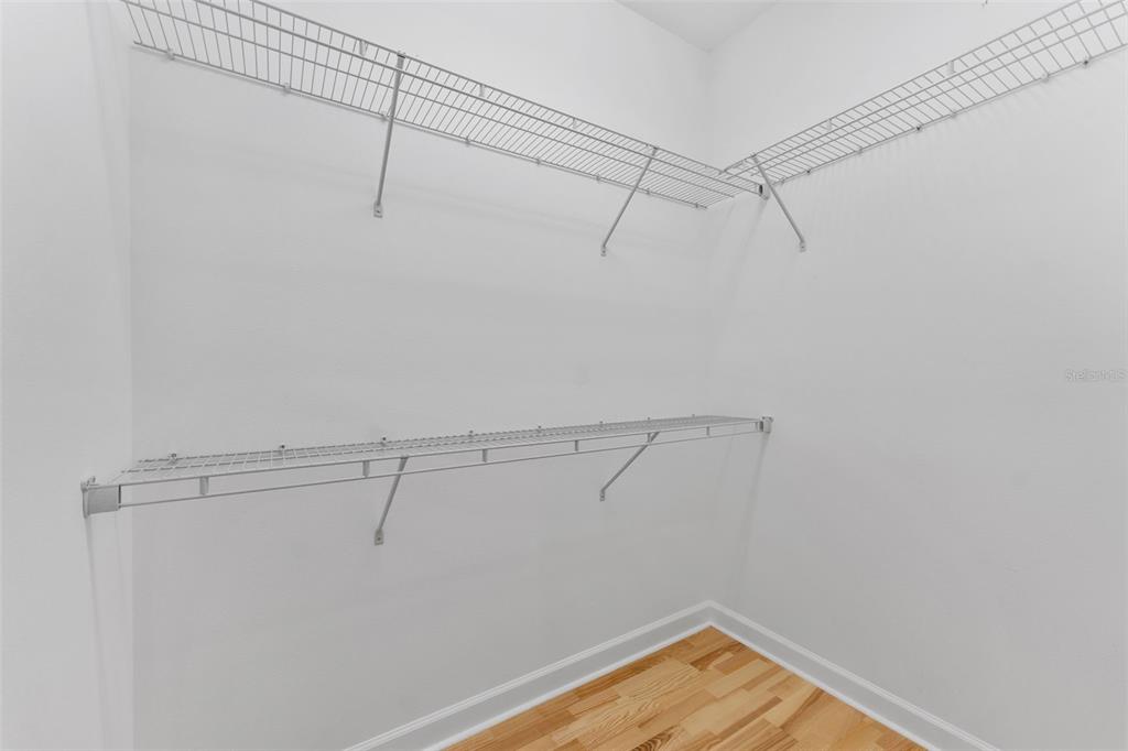 1264 Riserva Lane Palm Harbor, FL 34683 - Photo 15 of 28 a view of a room with racks on the wall