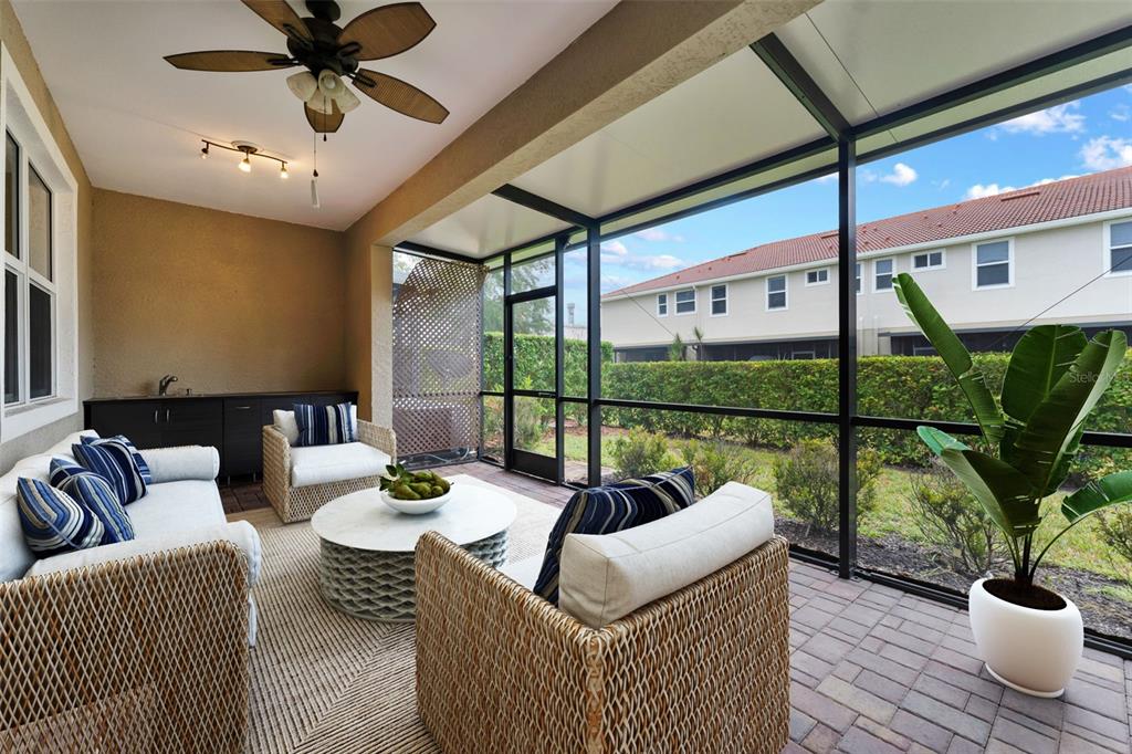 1264 Riserva Lane Palm Harbor, FL 34683 - Photo 21 of 28 a living room with furniture and a potted plant