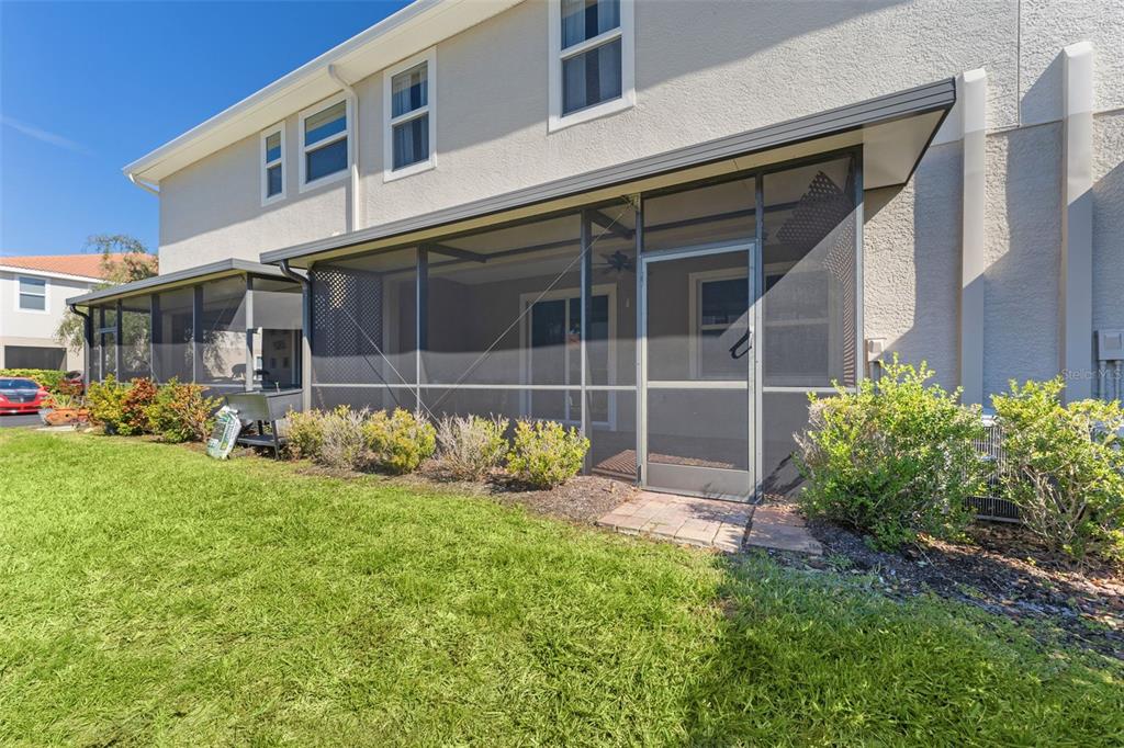 1264 Riserva Lane Palm Harbor, FL 34683 - Photo 24 of 28 a view of house with backyard