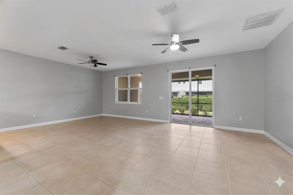 1264 Riserva Lane Palm Harbor, FL 34683 - Photo 4 of 28 a view of an empty room with a window